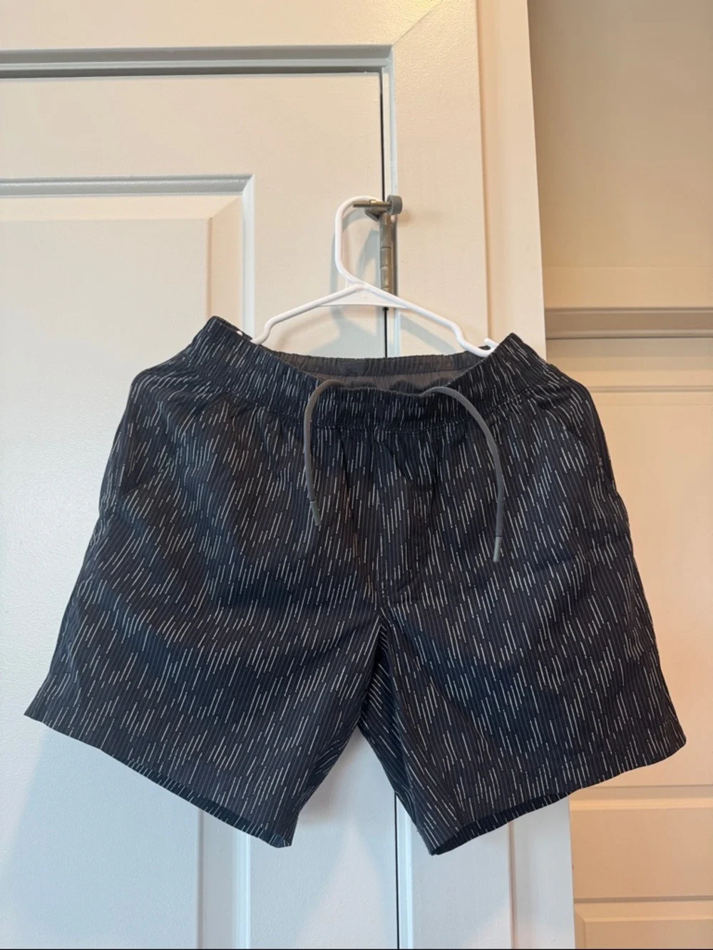 RHONE Black Swim Trunks with Subtle Dash Pattern